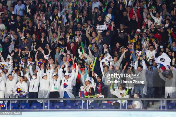 Fans of Korea show their support during the 19th Asian Game men's gold medal match between South Korea and Japan at Huanglong Sports Centre Stadium...