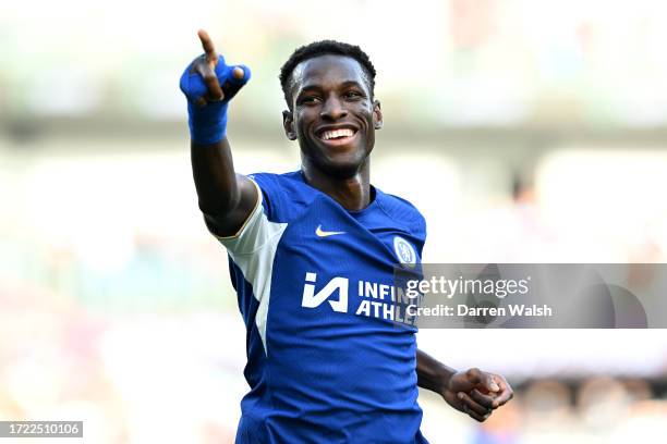 Nicolas Jackson of Chelsea celebrates after scoring their sides fourth goal during the Premier League match between Burnley FC and Chelsea FC at Turf...