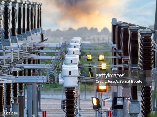 general view of a power distribution power plant at sunset. - transformer stock pictures, royalty-free photos & images