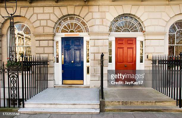 blue and red doors - blue house red door stock pictures, royalty-free photos & images