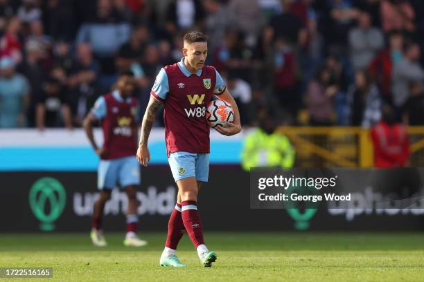 Josh Brownhill of Burnley looks dejected after Nicolas Jackson of Chelsea scores their sides fourth goal during the Premier League match between...