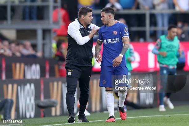 Mauricio Pochettino, Manager of Chelsea, interacts with Enzo Fernandez of Chelsea during the Premier League match between Burnley FC and Chelsea FC...