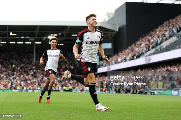 Tom Cairney of Fulham celebrates after Wes Foderingham of Sheffield United scores an own goal during the Premier League match between Fulham FC and...