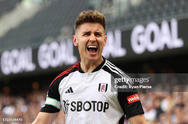 Tom Cairney of Fulham celebrates after Wes Foderingham of Sheffield United scores an own goal during the Premier League match between Fulham FC and...