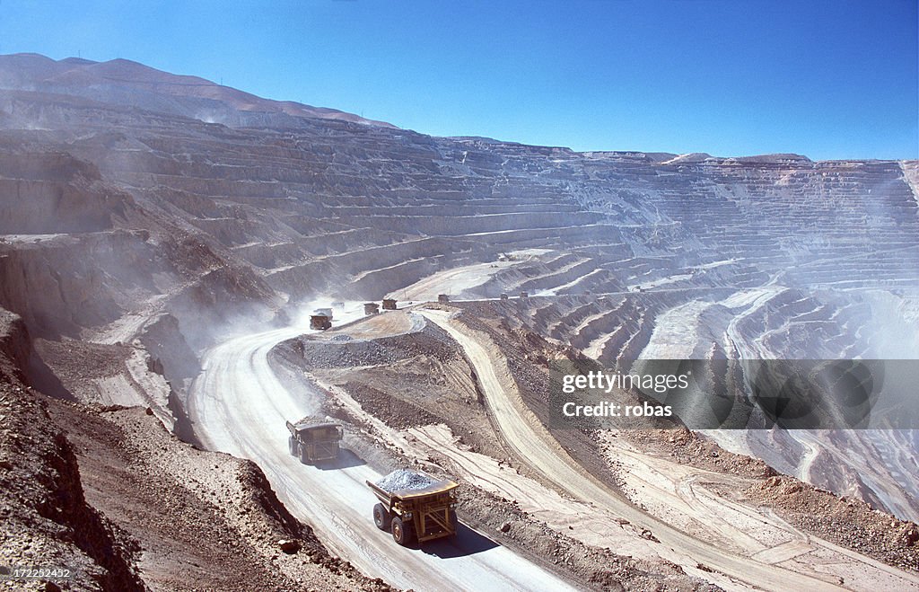 Ore trucks in an open-pit mine