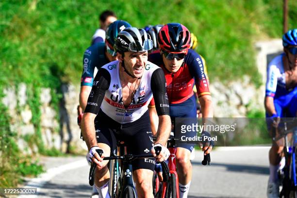 Adam Yates of Great Britain and UAE Team Emirates and Carlos Rodriguez of Spain and Team INEOS Grenadiers compete during the 117th Il Lombardia 2023...