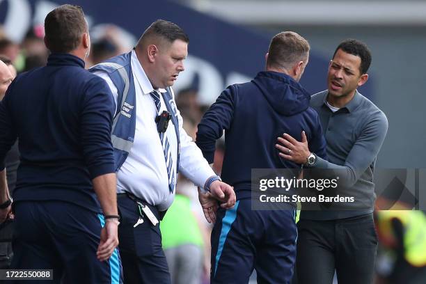 Liam Rosenior, Manager of Hull City and Millwall manager Gary Rowett interact after the Sky Bet Championship match between Millwall and Hull City at...