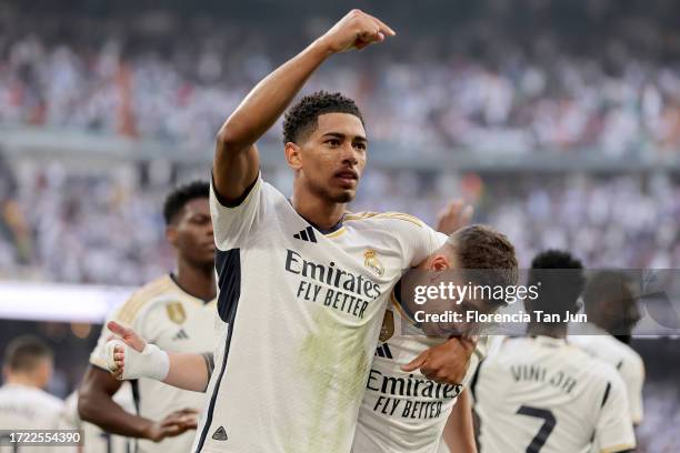 Jude Bellingham of Real Madrid celebrates with teammate Federico Valverde after scoring the team's second goal during the LaLiga EA Sports match...