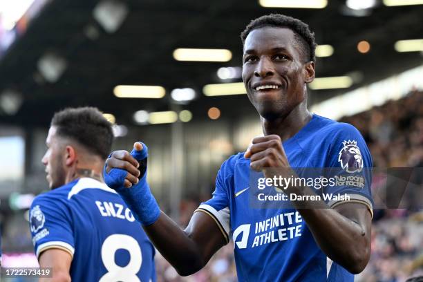 Nicolas Jackson of Chelsea celebrates after scoring their sides fourth goal during the Premier League match between Burnley FC and Chelsea FC at Turf...