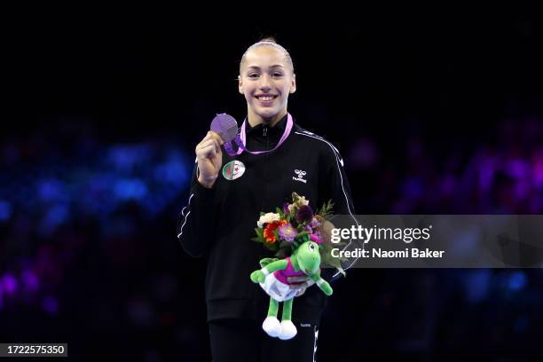 Silver medalist Kaylia Nemour of Team Algeria poses for a photo during the medal ceremony for the Women's Uneven Bars Final on Day Eight of the 2023...