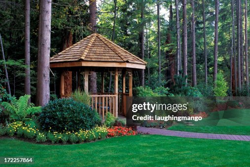 A beautiful backyard garden with a cedar wood gazebo