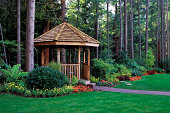 A beautiful backyard garden with a cedar wood gazebo