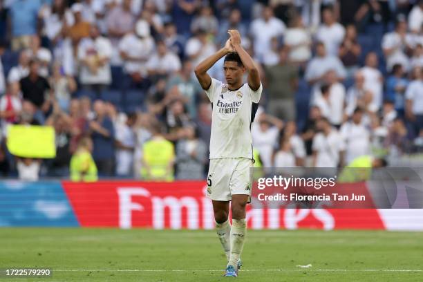 Jude Bellingham of Real Madrid acknowledges the fans following the team's victory during the LaLiga EA Sports match between Real Madrid CF and CA...