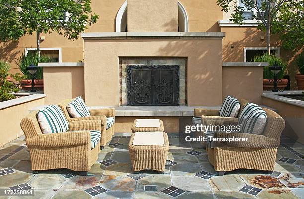 fireplace in outdoor patio - rattan stock pictures, royalty-free photos & images