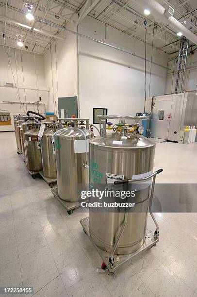 nitrogen containers inside an industrial building - gas cylinder stockfoto's en -beelden