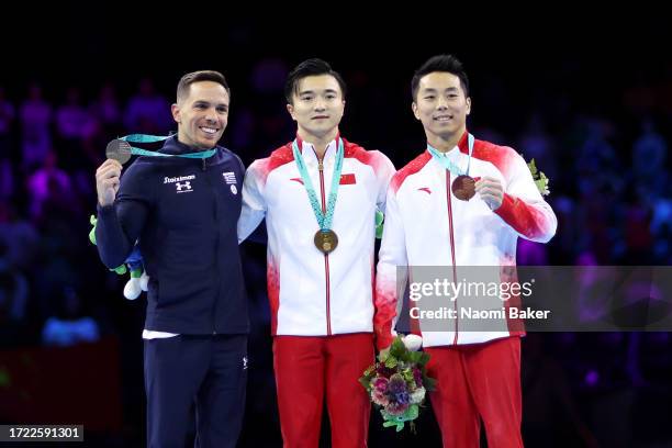 Silver medalist Eleftherios Petrounias of Team Greece, gold medalist Yang Liu of Team People's Republic and bronze medalist Hao You of Team People's...