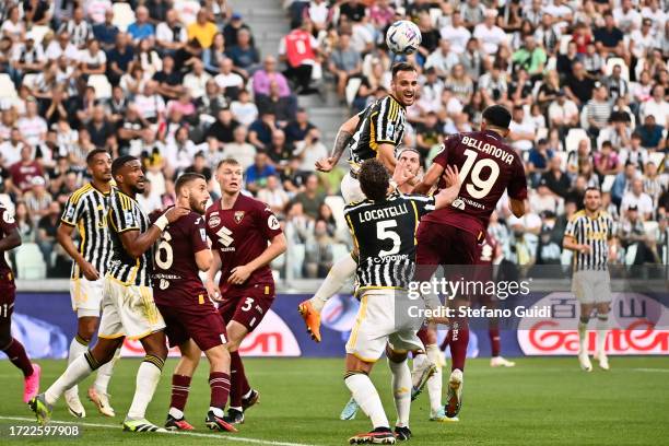 Federico Gatti of Juventus FC head the ball against Raoul Bellanova of Torino FC during the Serie A TIM match between Juventus and Torino FC at on...