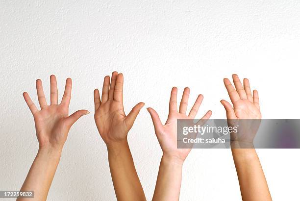 white people raising their hands  - kid hand raised stock pictures, royalty-free photos & images
