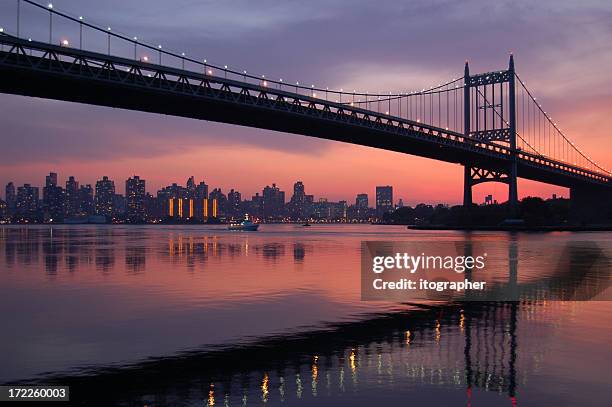 triboro bridge silhouette at sunset - queens bridge stock pictures, royalty-free photos & images