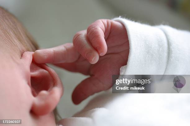 baby ear hand finger listen - ear stock pictures, royalty-free photos & images