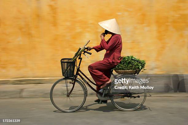cyclist in vietnam - vietnam stock pictures, royalty-free photos & images