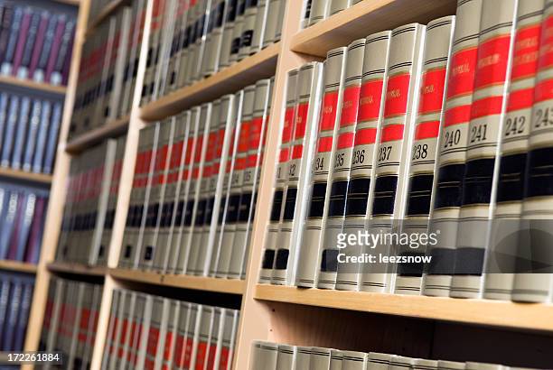 shelves of legal books in law library - law library stock pictures, royalty-free photos & images