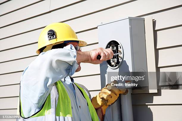 an electrician professional doing repairs - work glove stock pictures, royalty-free photos & images