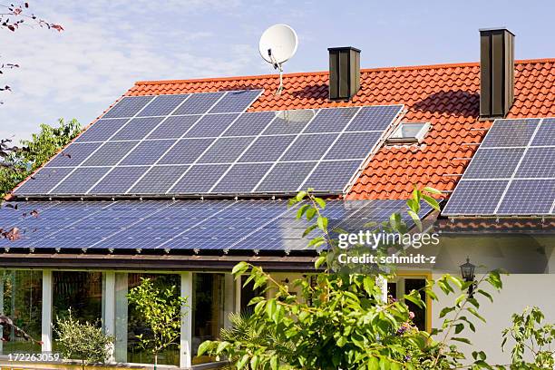 solar panels on a house rooftop - solar panel home stock pictures, royalty-free photos & images