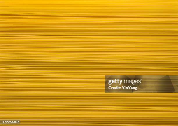 italian spaghetti pasta  dry noodle food background texture - spaghetti stock pictures, royalty-free photos & images