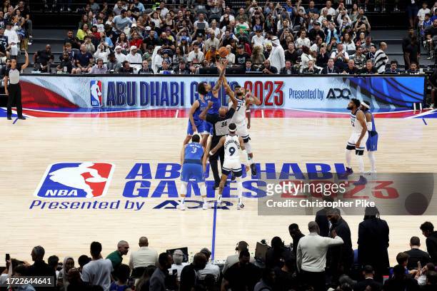 The opening tip-off during the preseason NBA game between Minnesota Timberwolves and Dallas Mavericks at Etihad Arena on October 07, 2023 in Abu...