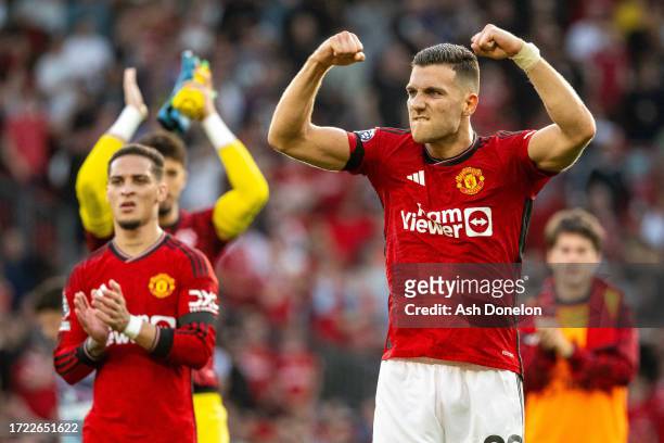 Diogo Dalot of Manchester United celebrates following their sides victory in the Premier League match between Manchester United and Brentford FC at...