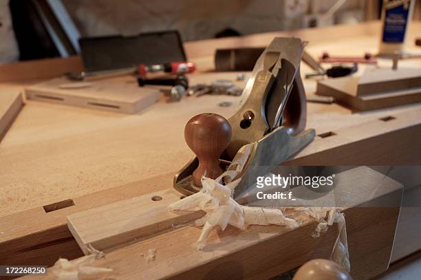 bronze smoothing plane with wood shavings - bespoke stock pictures, royalty-free photos & images