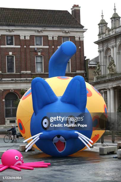 Huge inflatable cat and an octopus by Artist Bruce Asbestos take centre stage in the Cornhill on October 13, 2023 in Ipswich, United Kingdom. The...