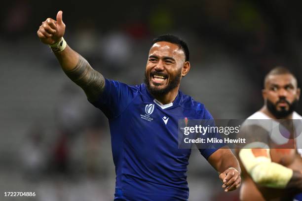 Manu Tuilagi of England, wearing the match shirt of Tumua Manu of Samoa after exchanging shirts, acknowledges the fans after the Rugby World Cup...