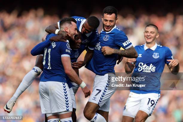 Jack Harrison of Everton celebrates with teammates after scoring the team's second goal during the Premier League match between Everton FC and AFC...