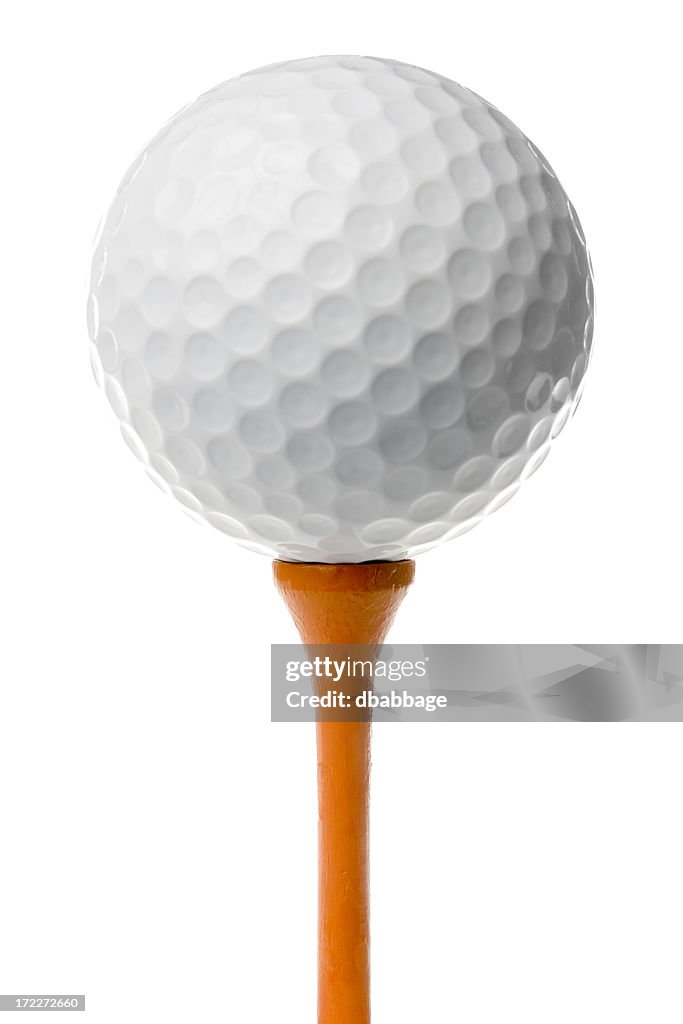 Golf ball on orange tee