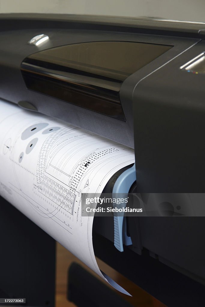 Plotter plotting some plans.