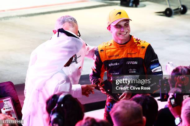 Sprint winner Oscar Piastri of Australia and McLaren celebrates with his trophy in parc ferme during the Sprint ahead of the F1 Grand Prix of Qatar...