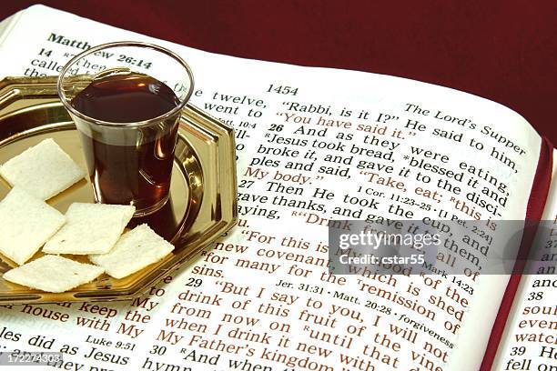 religious: the lord's supper with open bible - heilige communie stockfoto's en -beelden