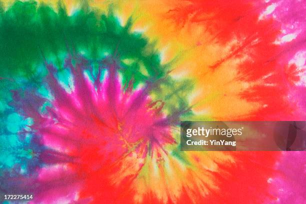psychedelic tie dye, a 1960s style symbol of peace background - tie dye stock pictures, royalty-free photos & images