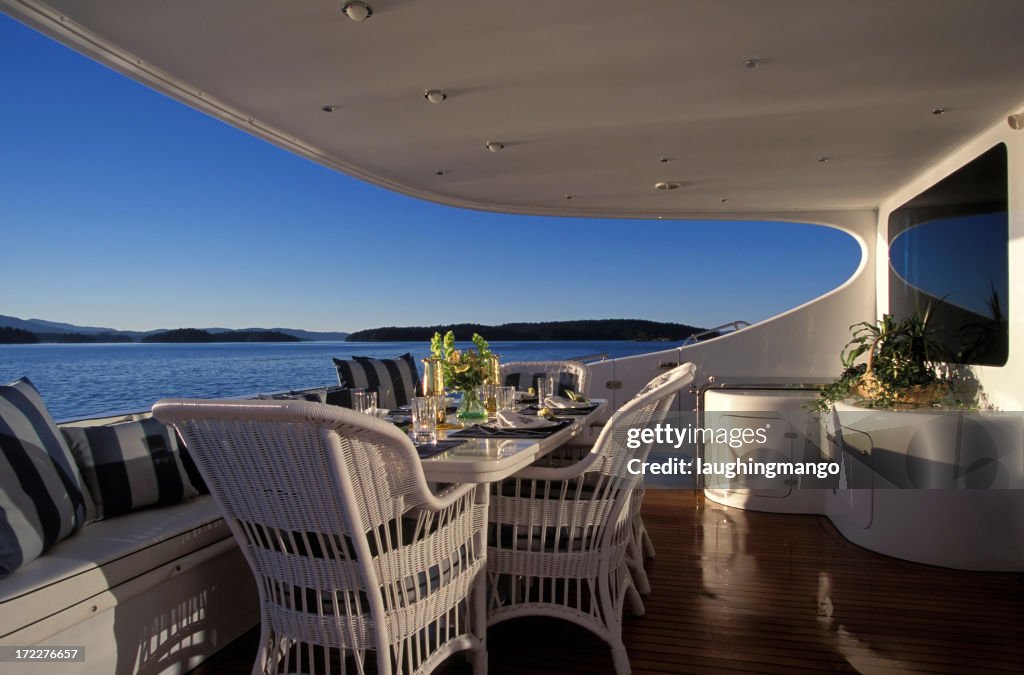 A luxury yacht deck with furniture