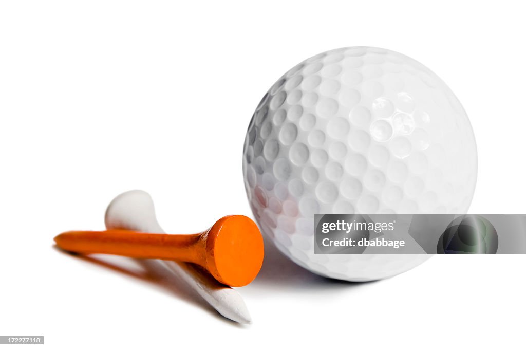 Dimpled golf ball and two tees on a white background