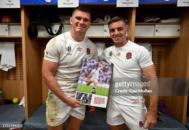 Owen Farrell of England poses for a photograph with a gift from Jonny Wilkinson, which features all of the fixtures and respective points for the...