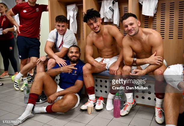 Ollie Lawrence, Henry Arundell, Marcus Smith and Danny Care of England pose for a photo in the changing room after the Rugby World Cup France 2023...