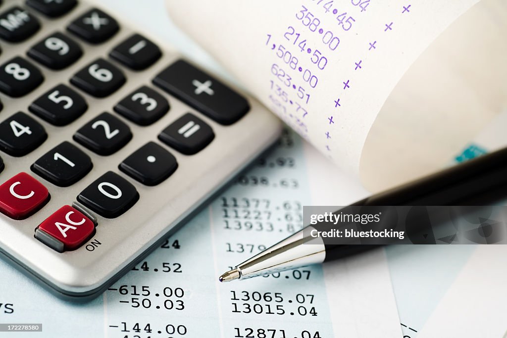 Account plans with a calculator and pen
