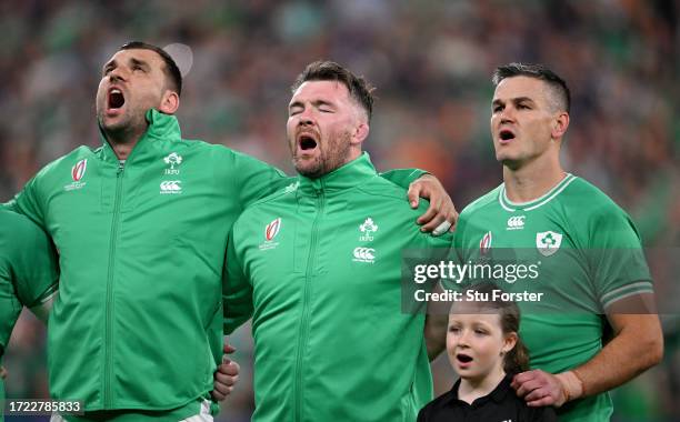 Tadhg Beirne, Peter O'Mahony and Johnny Sexton of Ireland sing their national anthem prior to the Rugby World Cup France 2023 match between Ireland...