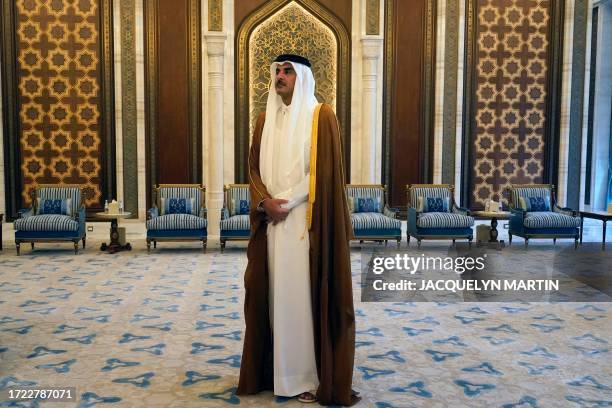 Qatar's Emir Sheikh Tamim bin Hamad al-Thani looks on as he waits for the US Secretary of State in Lusail on October 13, 2023. Blinken began on...