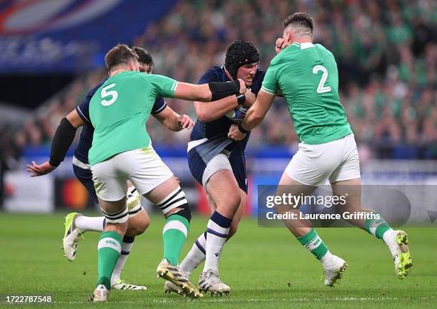 Zander Fagerson of Scotland is challenged by Iain Henderson and Dan Sheehan of Ireland during the Rugby World Cup France 2023 match between Ireland...