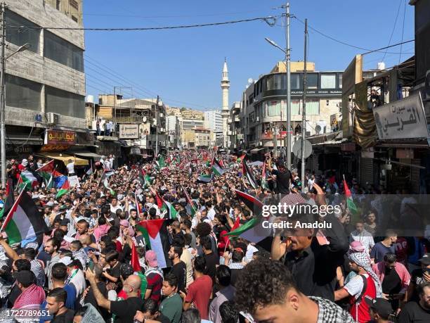 Jordanians march from Grand Husseini Mosque to Al-Nahl Square after the Friday prayer, within the demonstration in solidarity with Palestinians in...