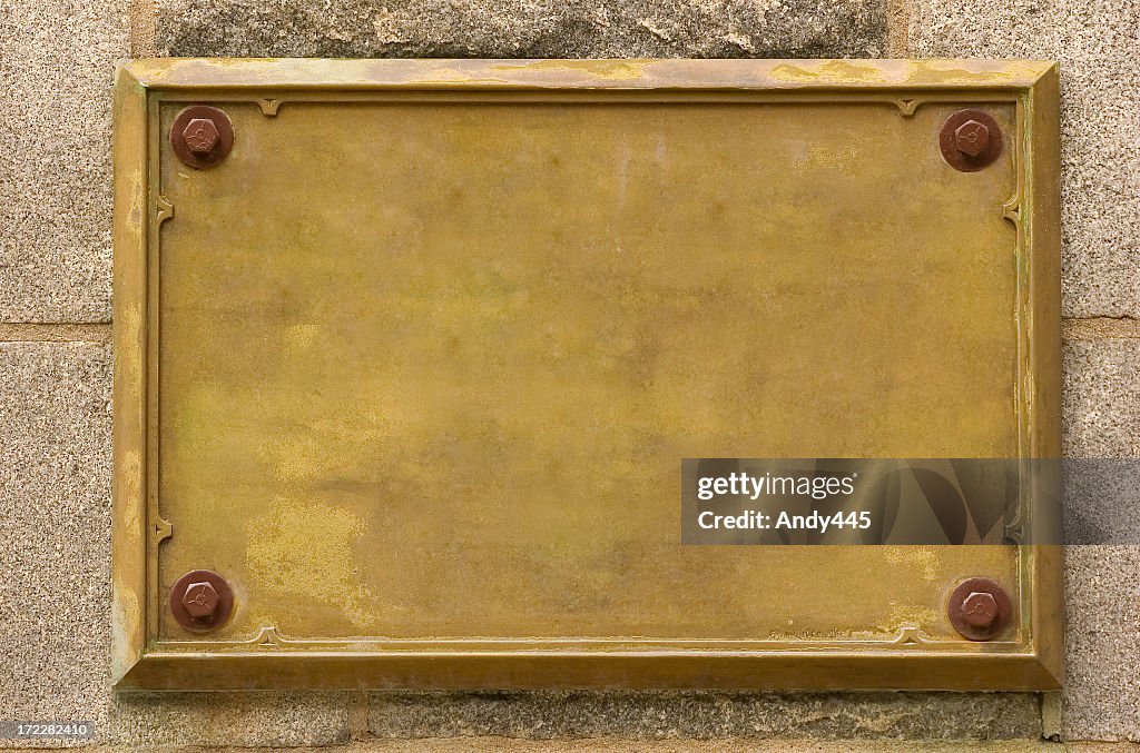 Bronze empty plaque fixed on wall